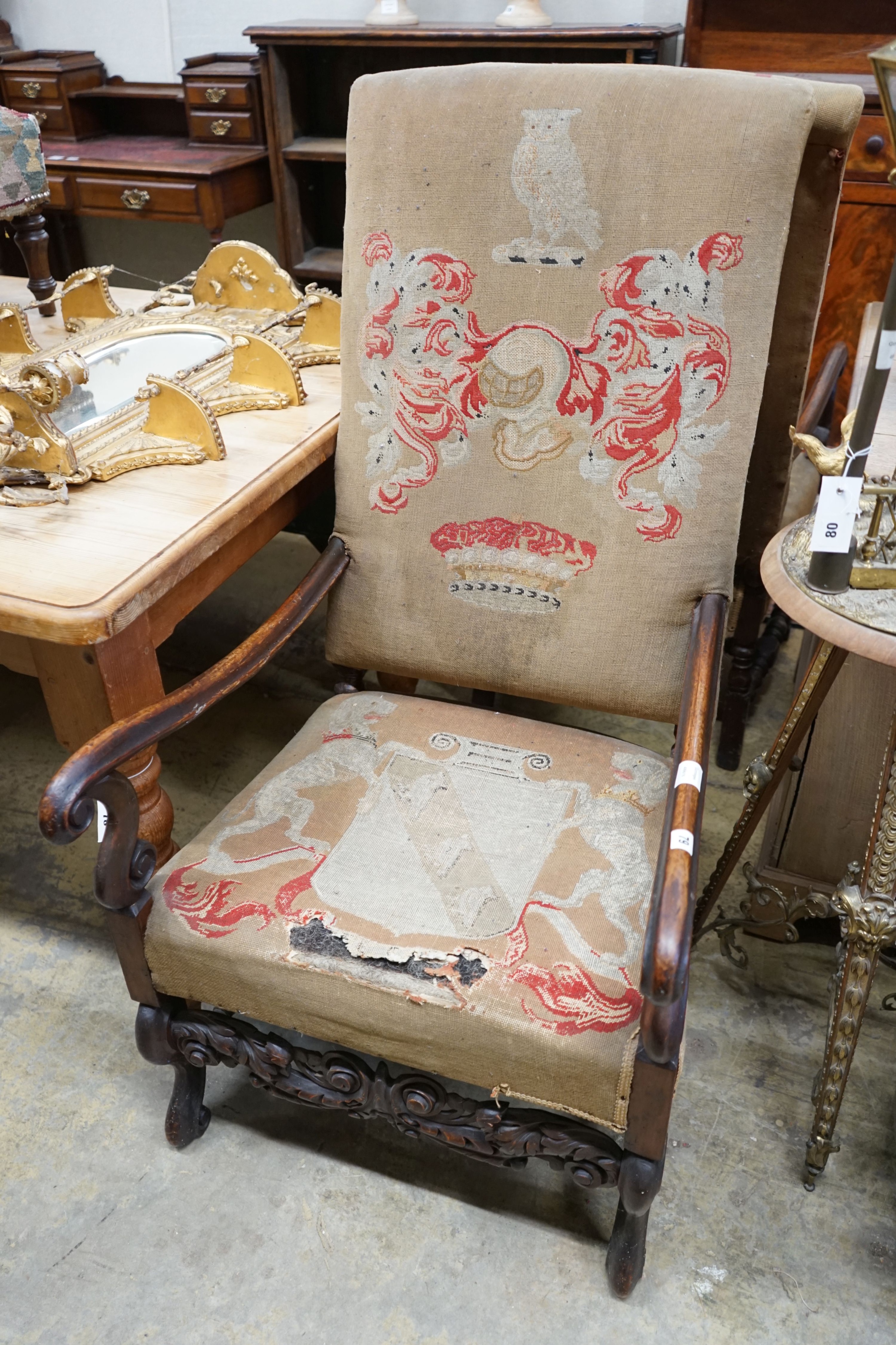 A pair of Carolean style walnut elbow chairs, width 61cm, depth 74cm, height 116cm